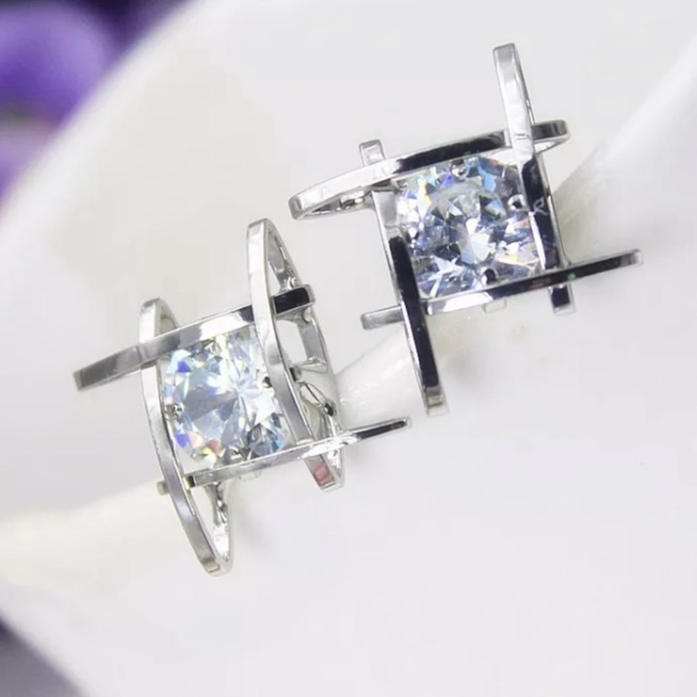 Unique three dimensional silver tone earrings
